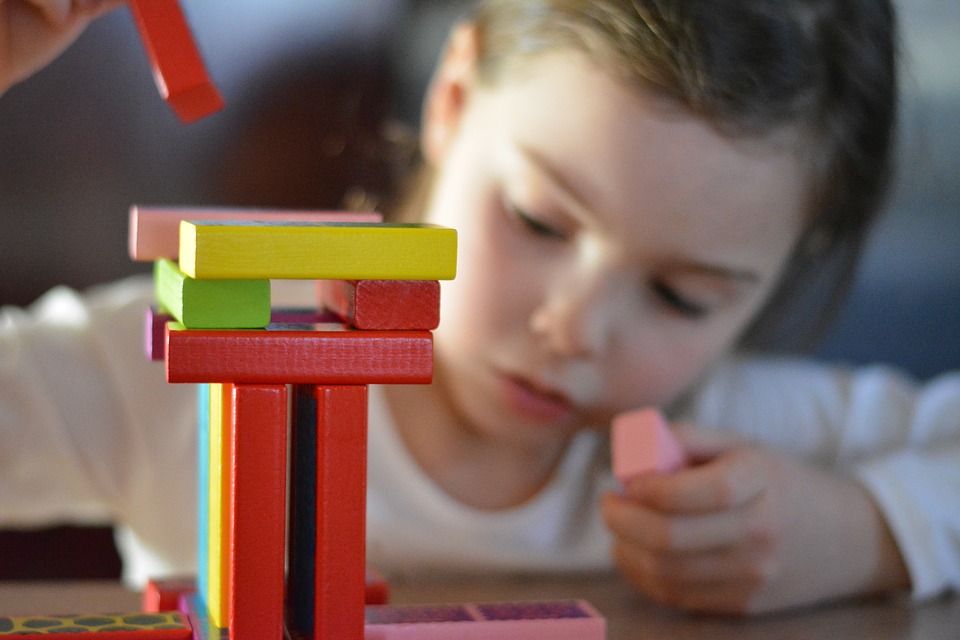 child playing with building blocks