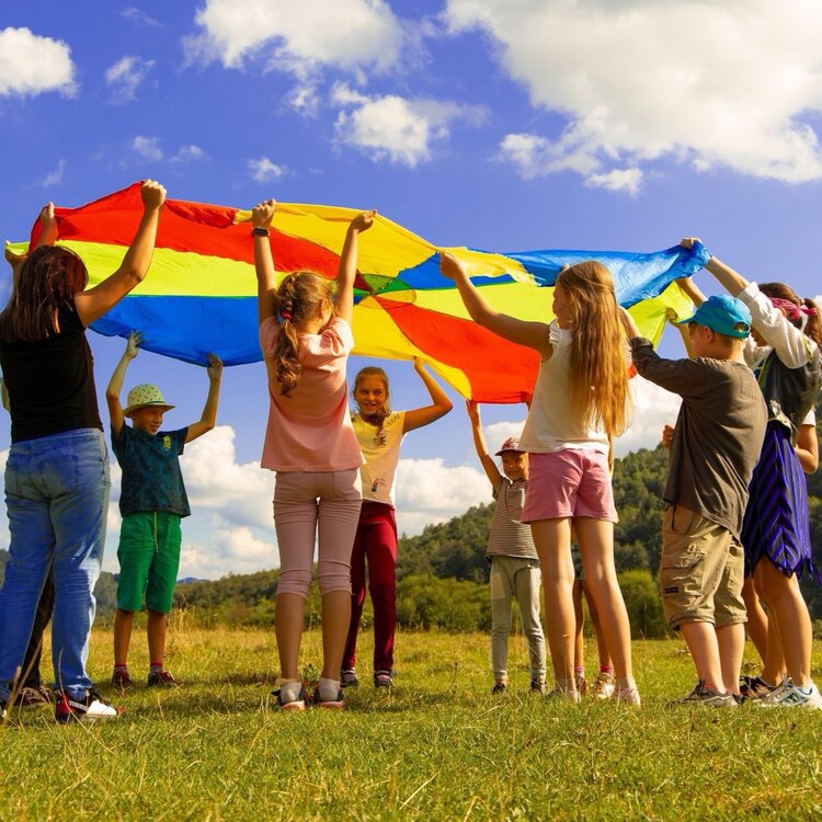 children playing with a parachute