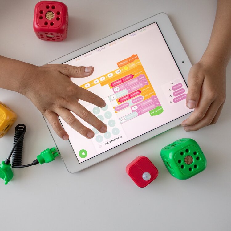 child playing an educational game on a tablet
